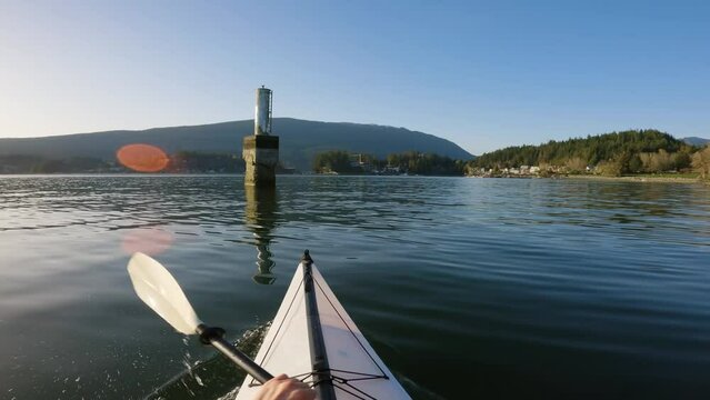 Kayaking in Indian Arm near Belcarra, Vancouver, BC, Canada. Sunny Sunset. Adventure Travel Concept