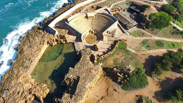 drone shot of the Roman archaeological site of tipaza overlooking the sea algeria