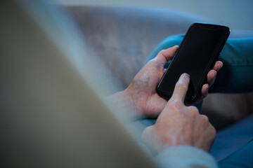 Social media and digital online concept, man using smart phone. The concept of living on vacation and playing social media. Social Distancing ,Working From Home