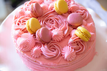 Pink raspberry cake with macarons