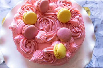 Pink raspberry cake with macarons