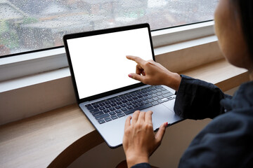 Mockup image blank screen computer with windows background, hand woman using laptop search information on desk