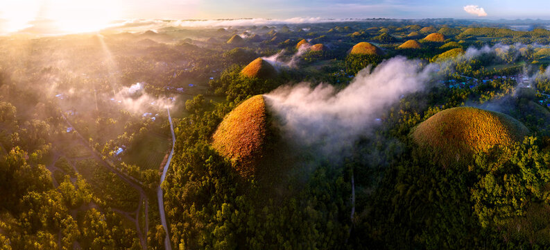 The Chocolate Hills are a geological formation in the Bohol province of the Philippines. They are covered in green grass that turns brown during the dry season, hence the name.