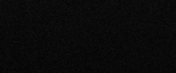 Texture of a wood splinter pressed wall, black painted surface of dark pressed wood chipboard texture background, the texture of the wood particle board painted black color.
