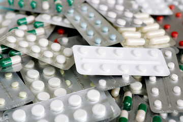 variety of pharmaceutical drugs, capsules, tablets as a background