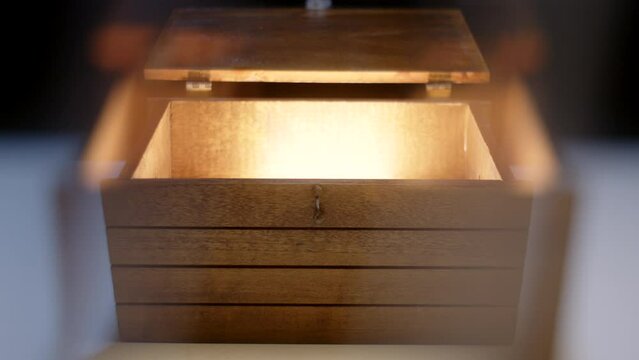 Slider Shot of Magical Treasure Box Open and Glowing Inside