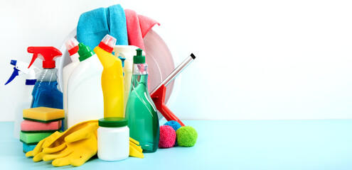 Cleaning products. Bottles, rubber gloves and sponge. Housework concept