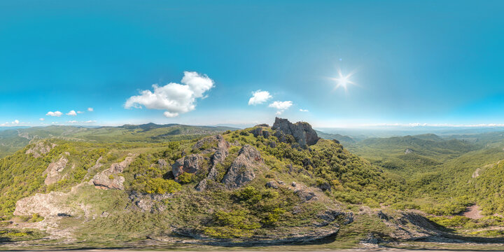 Image with 3D spherical panorama with 360 degree viewing angle. Ready for virtual reality in vr. Full equirectangular projection. Summer mountains with rocks. sun clouds, vegetation, greenery