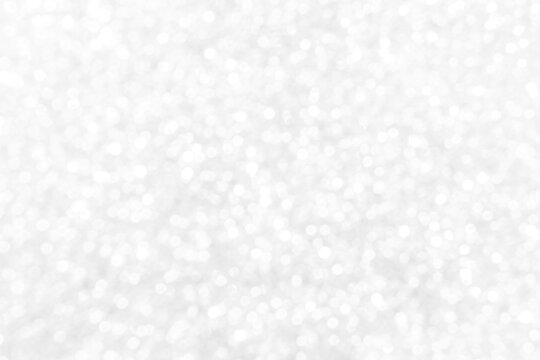 White and gray bokeh background. Photo can be used for the concepts of New Year, Christmas, Wedding Anniversary and all celebrations.	