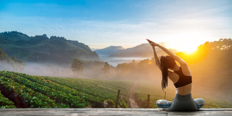 Young woman practicing yoga in the nature