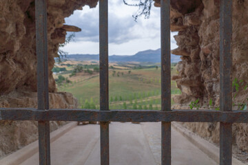 Fototapeta premium city walls of ronda ,malaga,spain seen from inside a cloudy stormy day