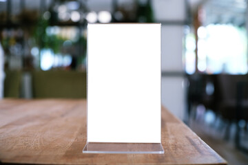 Menu frame standing on wood table in Bar restaurant cafe. space for text marketing promotion.