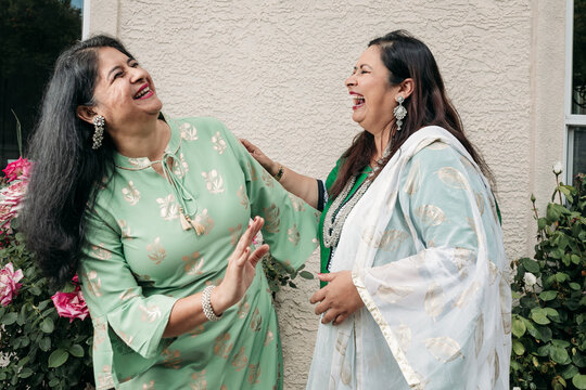 South Asian ladies enjoying their time together at home 