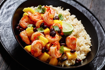 shrimps with beans, mango, brown rice in bowl