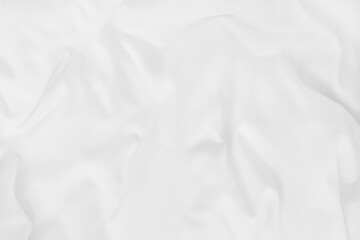 Close up top view of white bedding sheet and wrinkle messy blanket in bedroom after wake up in the morning.