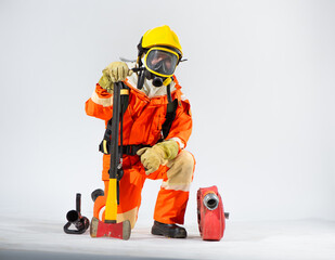 Professional firefighter is sitting and kneeling down on a white background with hand holding an iron axe.