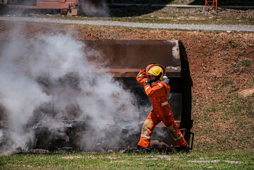 With every stride the weight of the fire hose serves as a reminder of the responsibility he bear to extinguish the flames and protect lives and property among the smoke.