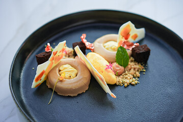 Sweet dessert on a dark plate