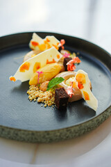 Sweet dessert on a dark plate