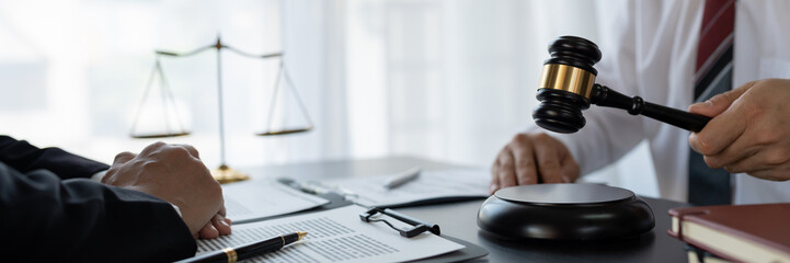 Lawyer or legal advisor finalizes the contract. Business legal agreements, constraints, consulting between lawyers and business clients, tax and legal firms. the concept of righteousness and justice