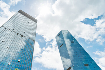 Modern office buildings under cloudy sky
