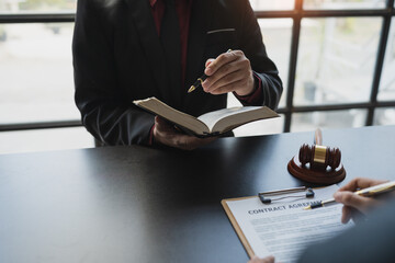 Attorneys or lawyers who are reading the statute of limitations Consultation between male lawyers...