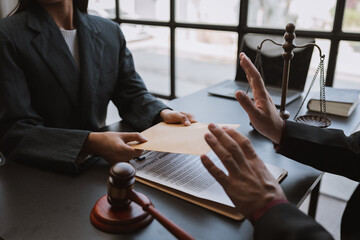 Lawyer or legal adviser, businessman refusing money coming with paper envelope Anti-bribery...