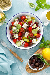 Greek salad. Vegetable salad with feta cheese, tomato, olives, cucumber, red onion and olive oil. Healthy vegetarian mediterranean diet food. Top view - obrazy, fototapety, plakaty