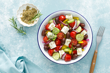 Greek salad. Vegetable salad with feta cheese, tomato, olives, cucumber, red onion and olive oil....