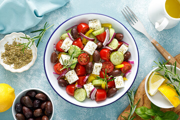 Greek salad. Vegetable salad with feta cheese, tomato, olives, cucumber, red onion and olive oil....