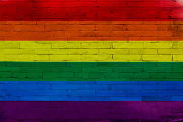 Rainbow flag on a brick wall