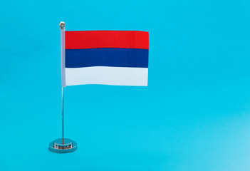 Republika Srpska flag on blue background
