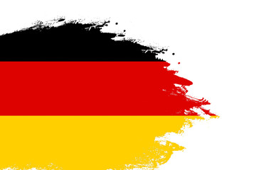 Germany flag on a stained stroke brush painted isolated white background with copy space