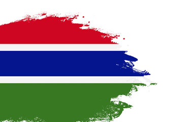 Gambia flag on a stained stroke brush painted isolated white background with copy space
