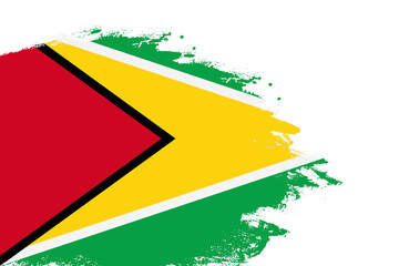 Guyana flag on a stained stroke brush painted isolated white background with copy space