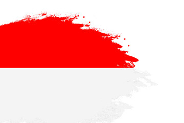 Indonesia flag on a stained stroke brush painted isolated white background with copy space