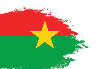 Burkina Faso flag on a stained stroke brush painted isolated white background with copy space
