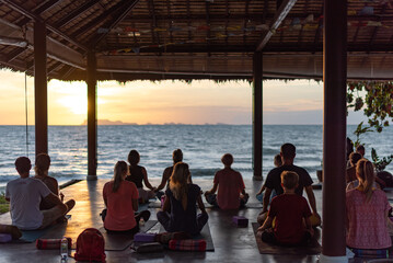 meditation by the sea at sunset, yoga as a healthy lifestyle, a journey into yourself