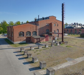 A vintage factory and former repair and storage facility for locomotives in Malmö, Sweden made of red bricks 