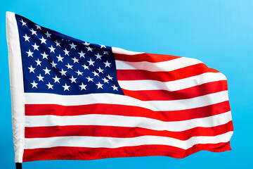 American flag waving on blue background