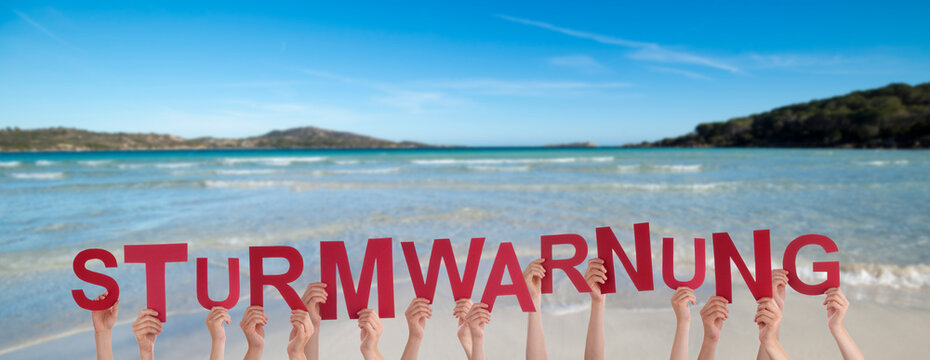 People Hands Building Word Sturmwarnung Means Storm Warning, Ocean And Sea