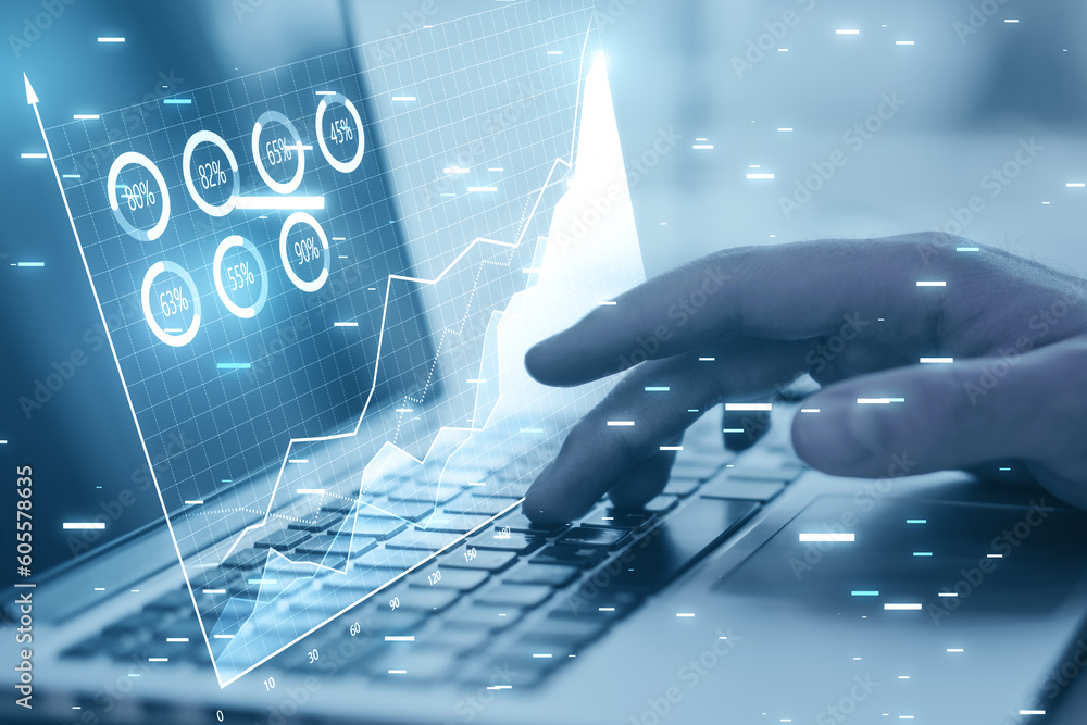 Poster close up of male hands using laptop keyboard at table with digital business chart hologram on blurry