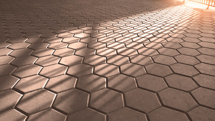 Sunlight and shadow on surface of geometric Hexagon Brown stone blocks Pavement floor in vintage and monochrome style