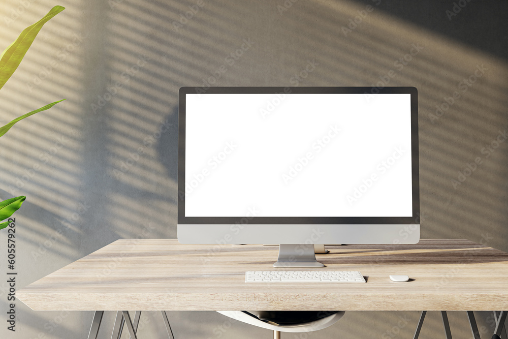 Poster front view of a home workplace with wooden desk with blank white screen modern computer on dark wall