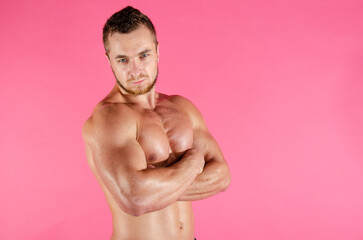 Fototapeta premium Young handsome guy on a diet. A man with a beautiful athletic body. 