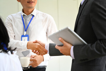 Partnership, business people shaking hands at office meeting, collaboration, agreement, welcome or greeting