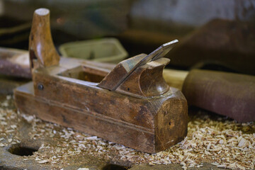 A wooden plane in an old workshop.