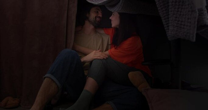Cozy Homemade Fort: Romantic Conversation and Intimacy Between a Loving Couple in the Dim Light