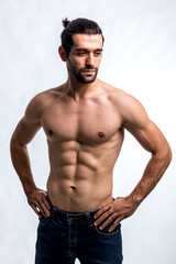 Fototapeta premium Fit and handsome man with beautiful torso. Strong and handsome ,fit and sporty bodybuilder man. Man Fitness Model Torso showing six pack abs
