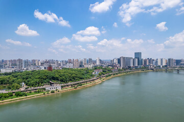Obraz premium Cityscape under the blue sky and white clouds in Zhuzhou, China